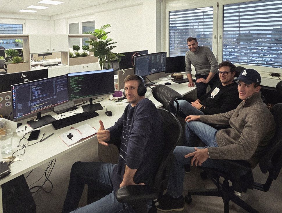 The GeckoDub team at their office working on AI video ad translation software